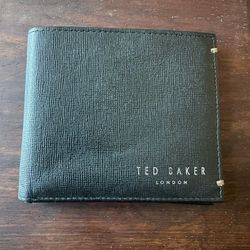 Ted Baker black leather wallet with silk detail on the inside.