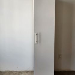 Tall white storage cabinet