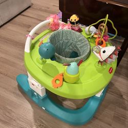 Baby walker- used like new! Can be wiped down and toys come in and out and attachments can be added. It also has 4 different modes and sizes. Regular 