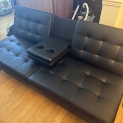Faux leather black futon with cup holders