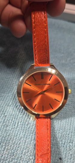 Figaro Couture Orange & Gold Women's Quartz WatchBold Figaro Couture women's quartz watch featuring a metallic orange sunburst dial, matching orange s