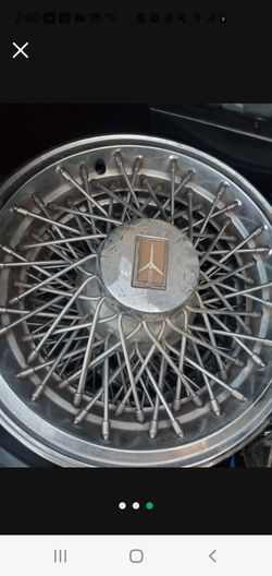 Oldsmobile Cutlass wire hub caps original s 14in