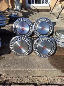 14" chevy Malibu classic hubcap set