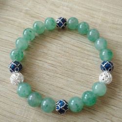 Crafted from natural icy jade, each bead offers a cool, translucent beauty with a smooth, polished finish. Subtle natural veining makes every piece un