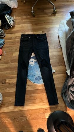 Black knee ripped purple jeans