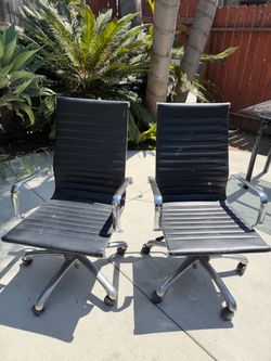 Pair of Black Ribbed Office Chairs with Chrome Base