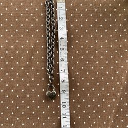 bebe darkened chunky chain with 1” puffy heart. Rhinestones one side/logo other