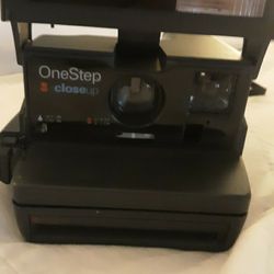 ONE STEP POLAROID CAMERA. PICTURE COMES OUT AFTER YOU TAKE A PICTURE.