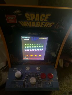 Space Invaders and Galaga arcade machines