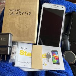 Samsung Galaxy S5 Phone And Gear S2 Watch