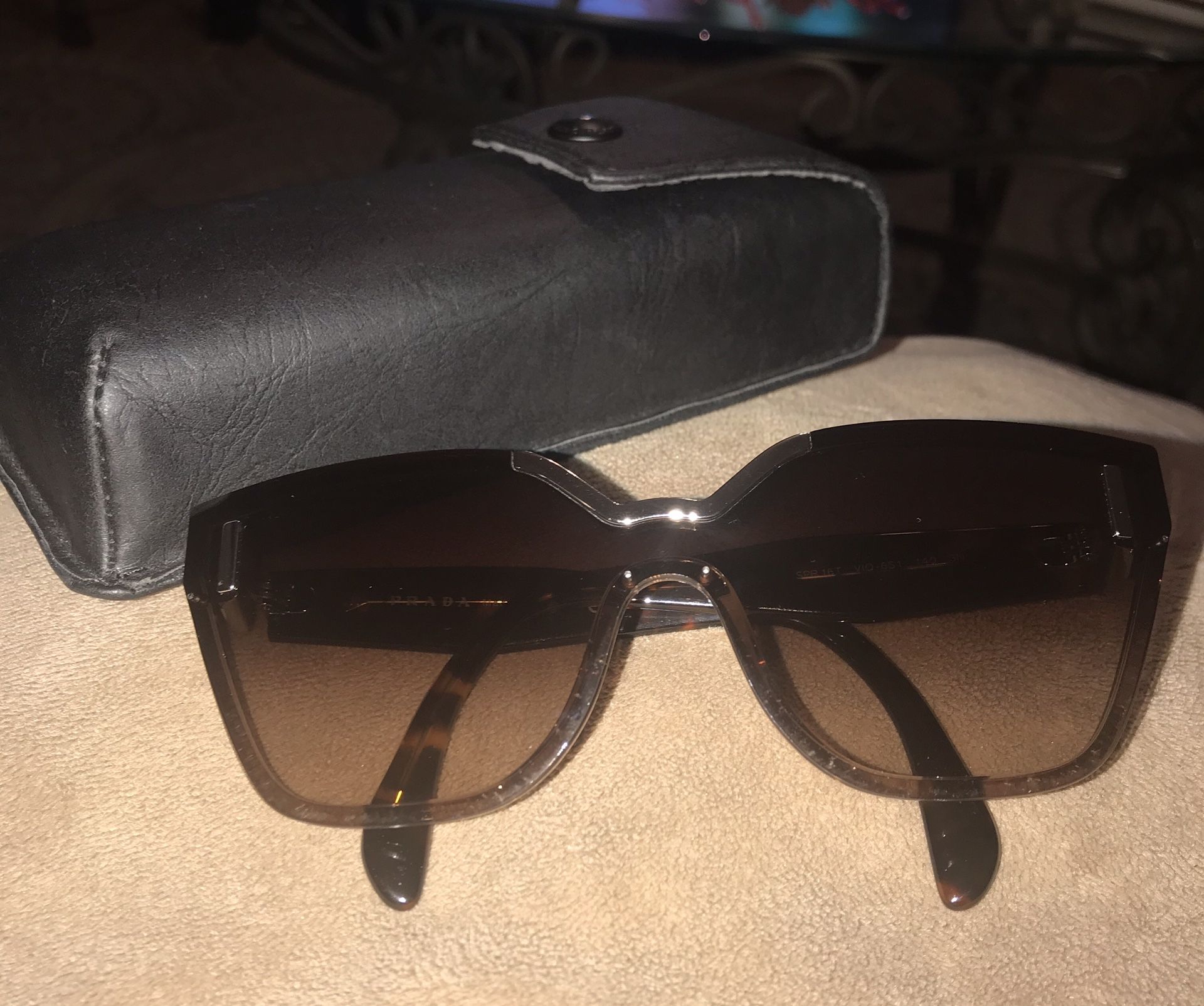 Original Prada ladies sunglasses with case.New never used