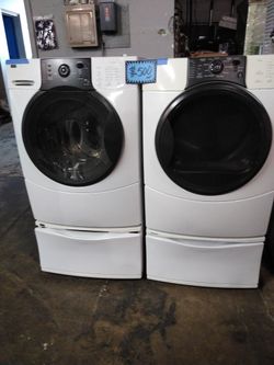 Kenmore front load washer and dryer set with pedestals working perfectly 4 months warranty