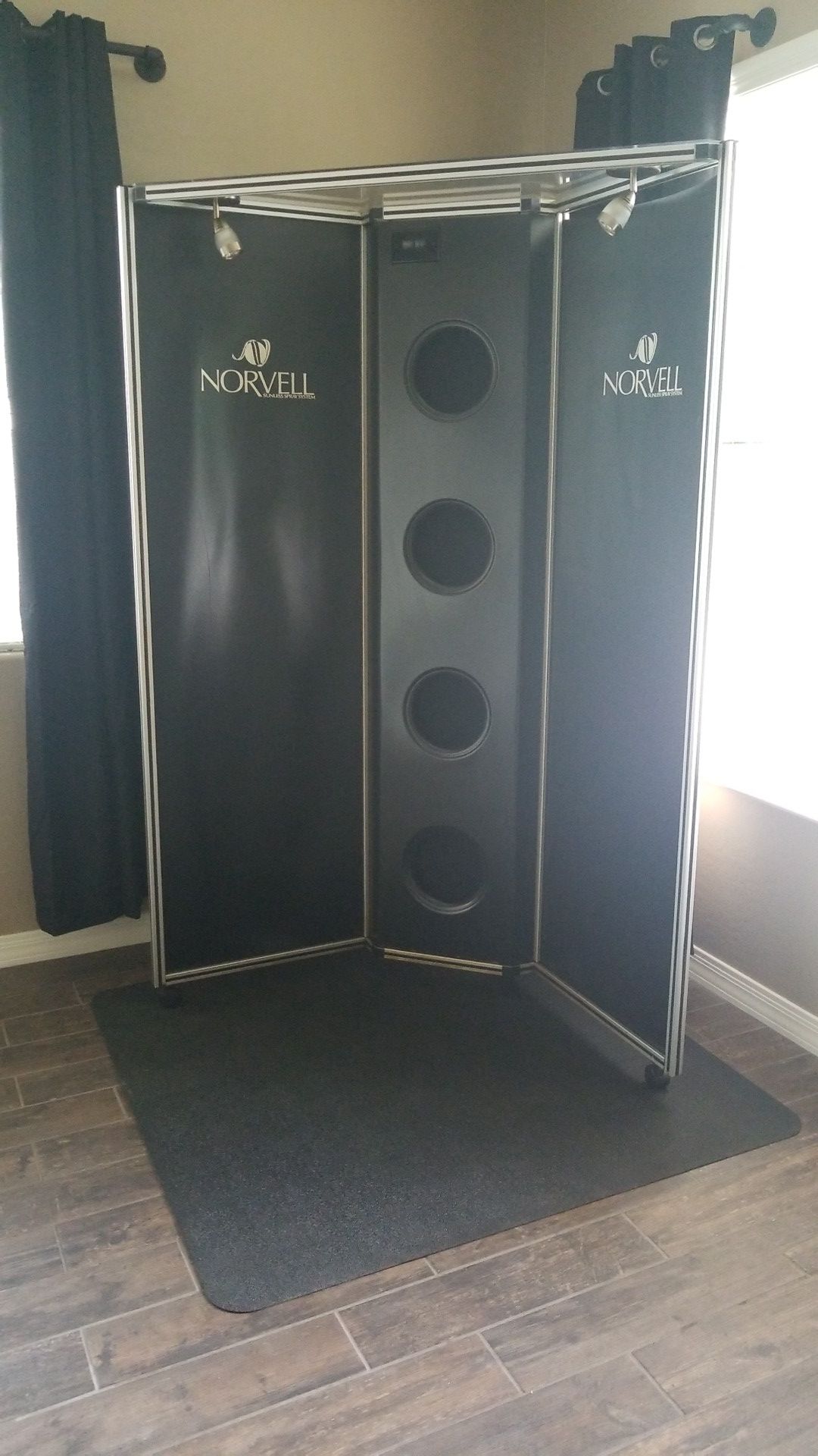 Norvell spray tan overspray booth with extraction fans