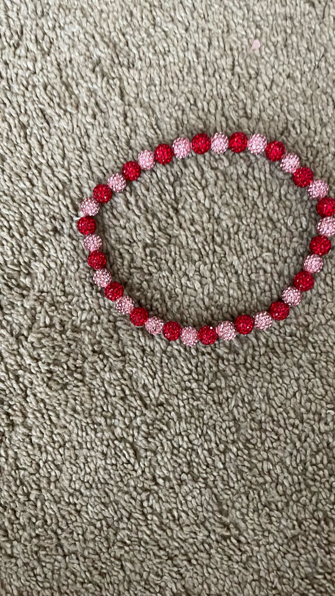 It Is A Red And Pink Baseball Necklace