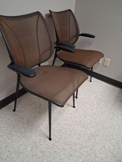 2 human scale waiting chairs