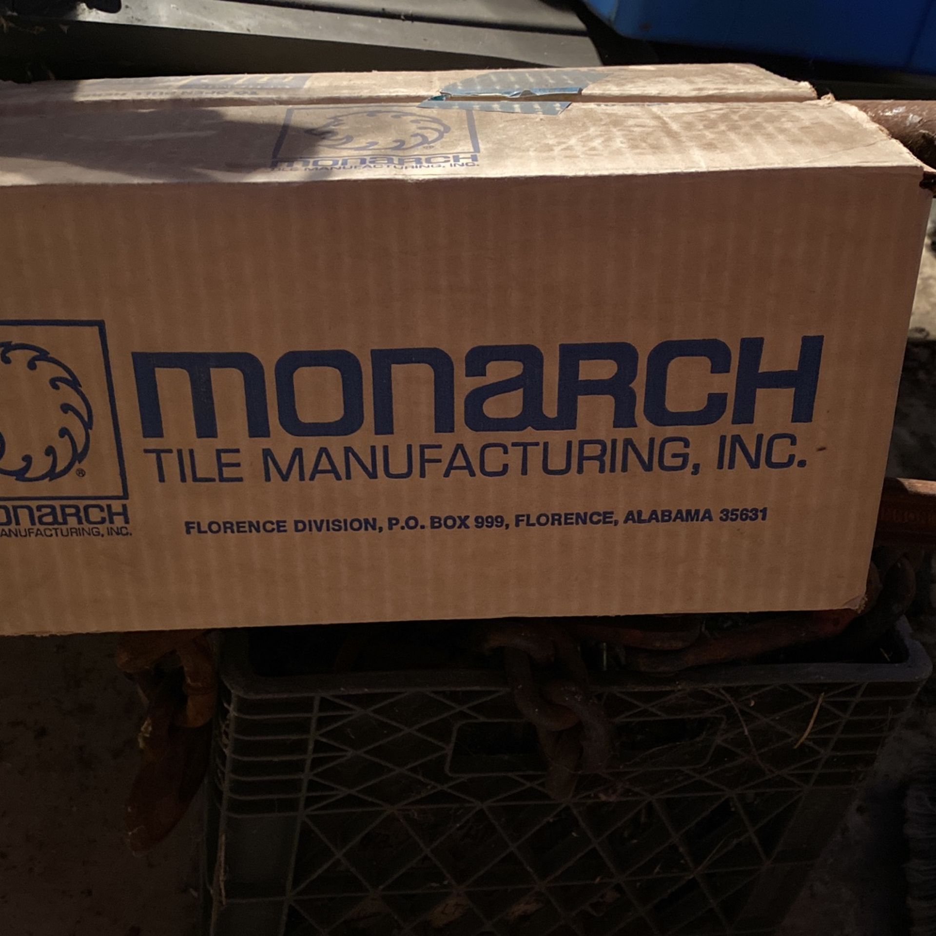 old blue bathroom tile and some marble looking