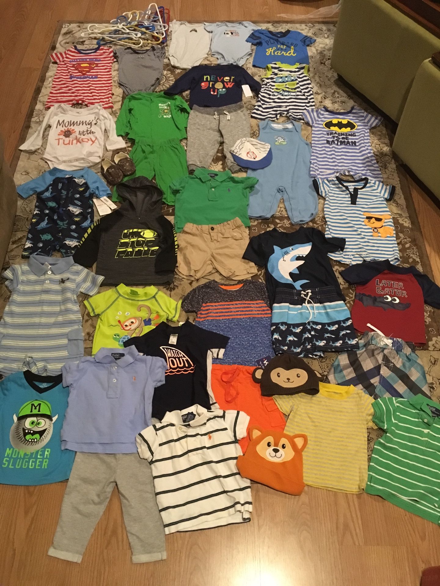 Baby boy 6-9 month clothes. 33 items of clothing, a pair of camouflage slippers, 3 hats and 12 hangers