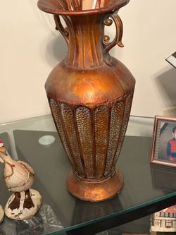 Metal vase. 19” tall.