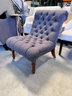 Grey tufted armless chair