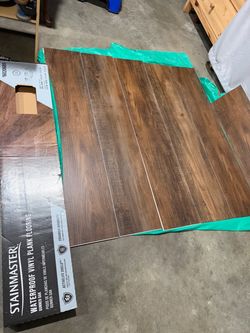 item is STAINMASTER Gunner Oak Waterproof Luxury Vinyl Plank Flooring 22 ml