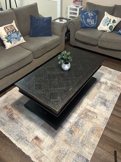 Coffee table with lift top and storage