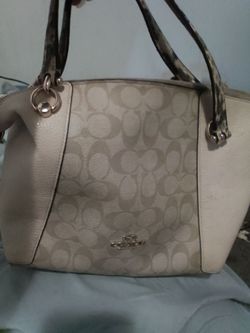 Cream and brown Coach purse