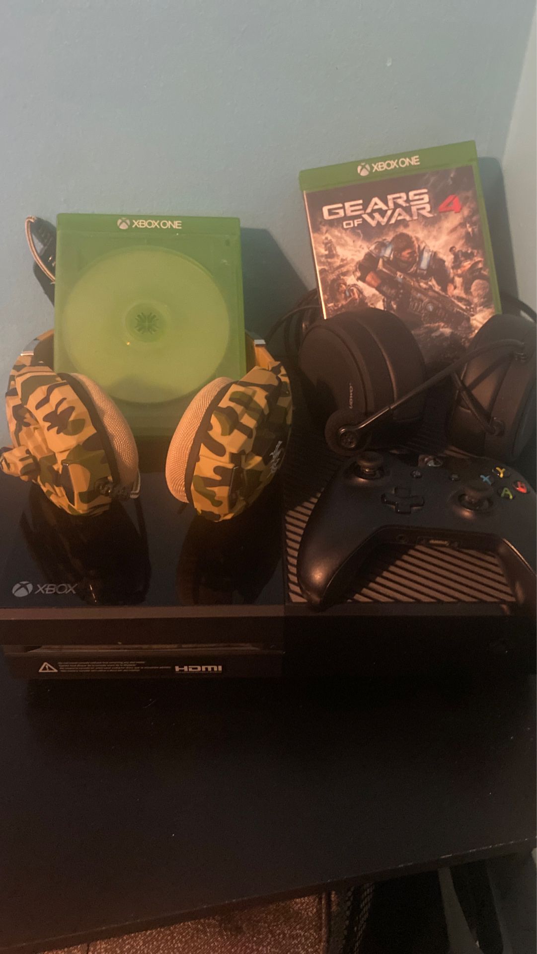 Xbox one with two games two headsets and a controller