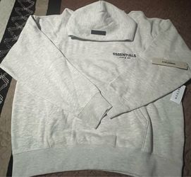Medium and Large light oat Essential Hoodie