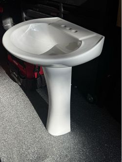 Pedestal sink. Open box but new.