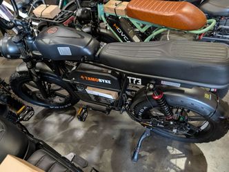 E-bike dirt bike with suspension system and powerful battery.