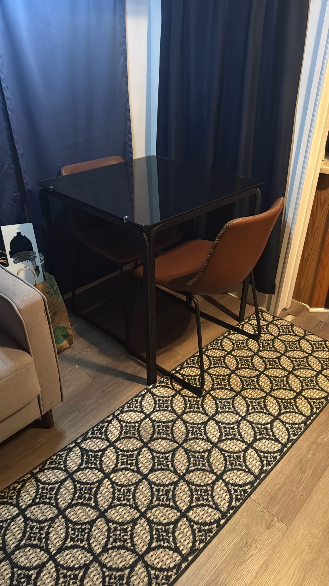 Glass Table With Two Leather Chairs