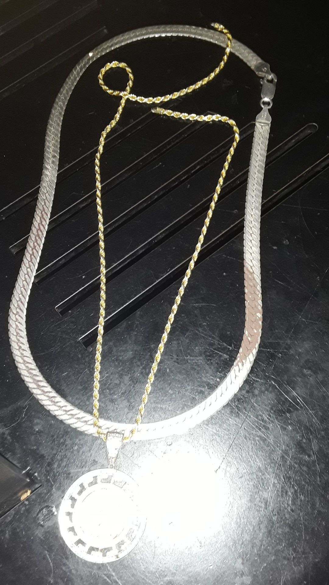 14 kart gold chain with crushed diamond piece and sterling silver haring bone