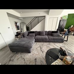 Large gray sectional sofa with admin