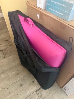 Pink portable massage table