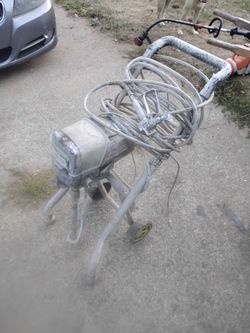 Airless paint pump with hose and nozzle