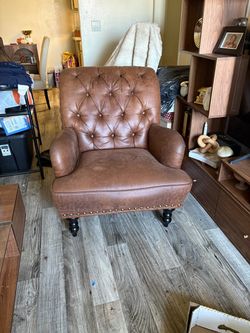 Brown tufted faux leather accent chair w/nailhead trim