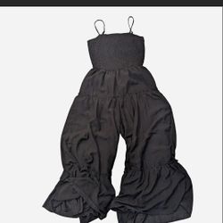 Black linen romper with ruffle detail 