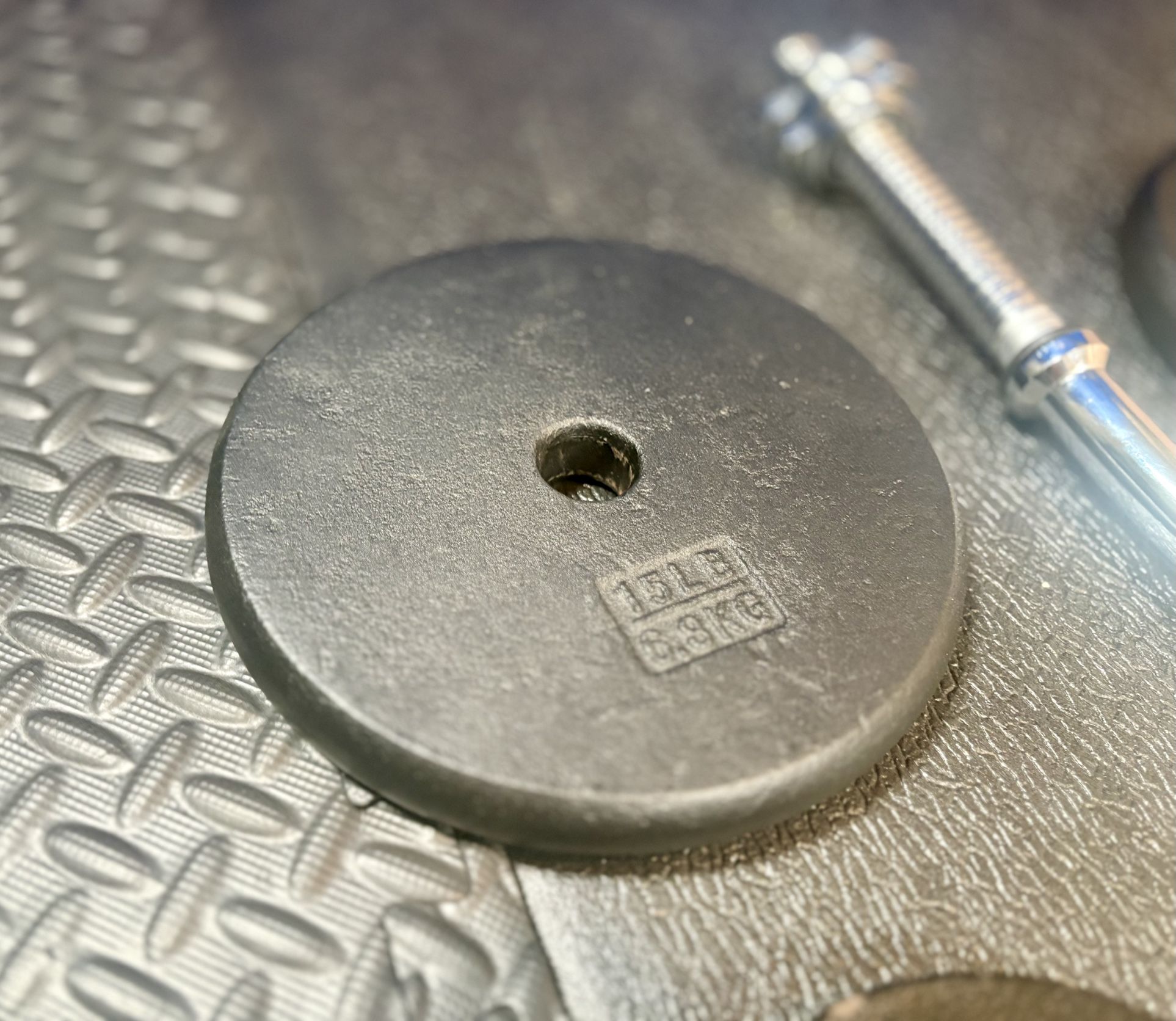 Standard Steel Curl Bar with Cast Iron Weight Plates pairs: 15#, & 4X 5 #. Total: 66 pounds