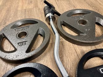 Olympic Curl Bar with Cast Iron Plates Three Grip: 35s, 25s, 10s and 5s. Total: 167 lbs