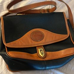 vintage Dooney & Bourke All-Weather Leather duck bag or satchel in black with tan trim