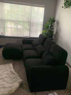 Sectional black couch + ottoman & 3 pillows