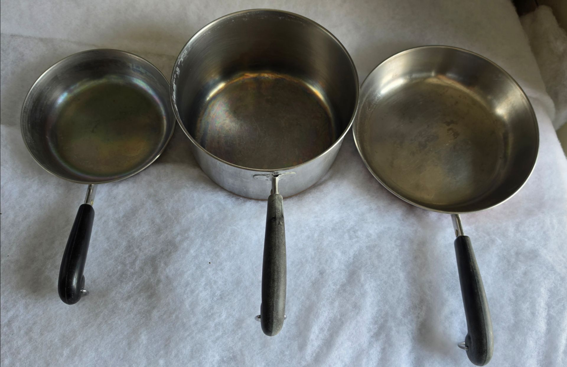 set of three Revere Ware pots and pans. Stainless steel with copper bottoms vintage
