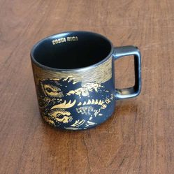 STARBUCKS Costa Rica Coffee Mug Two Fish 14 oz Matte Black Gold 
Stackable 2016 Pre-owned, good shape, 