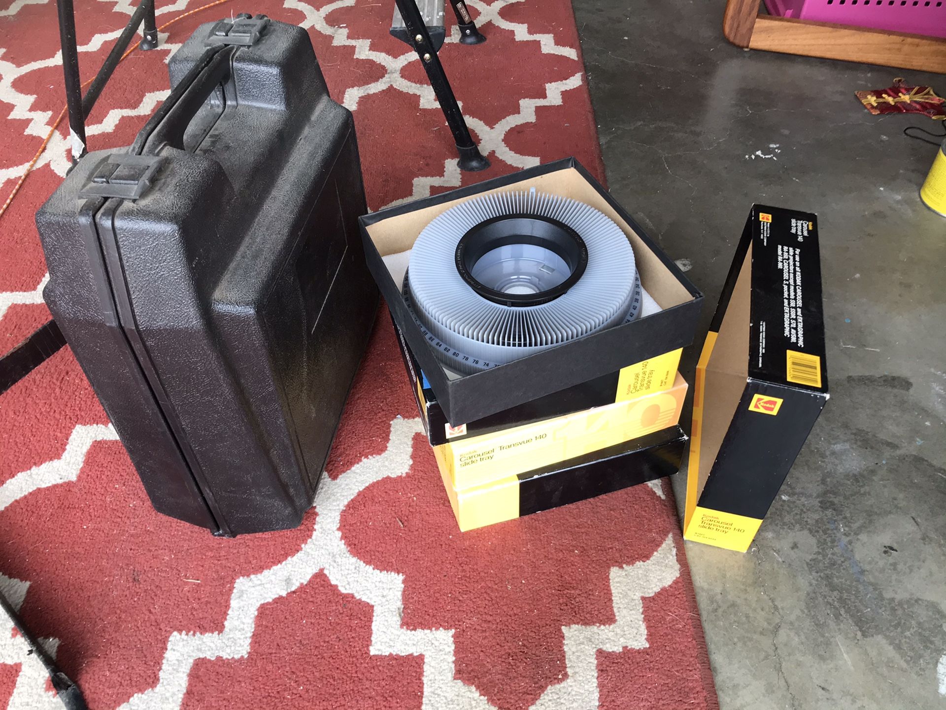 Vintage portable KODAK film slide projector and group of tray carousels