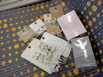 Silver hoop earrings and studs. 1 cologne and 1 perfume