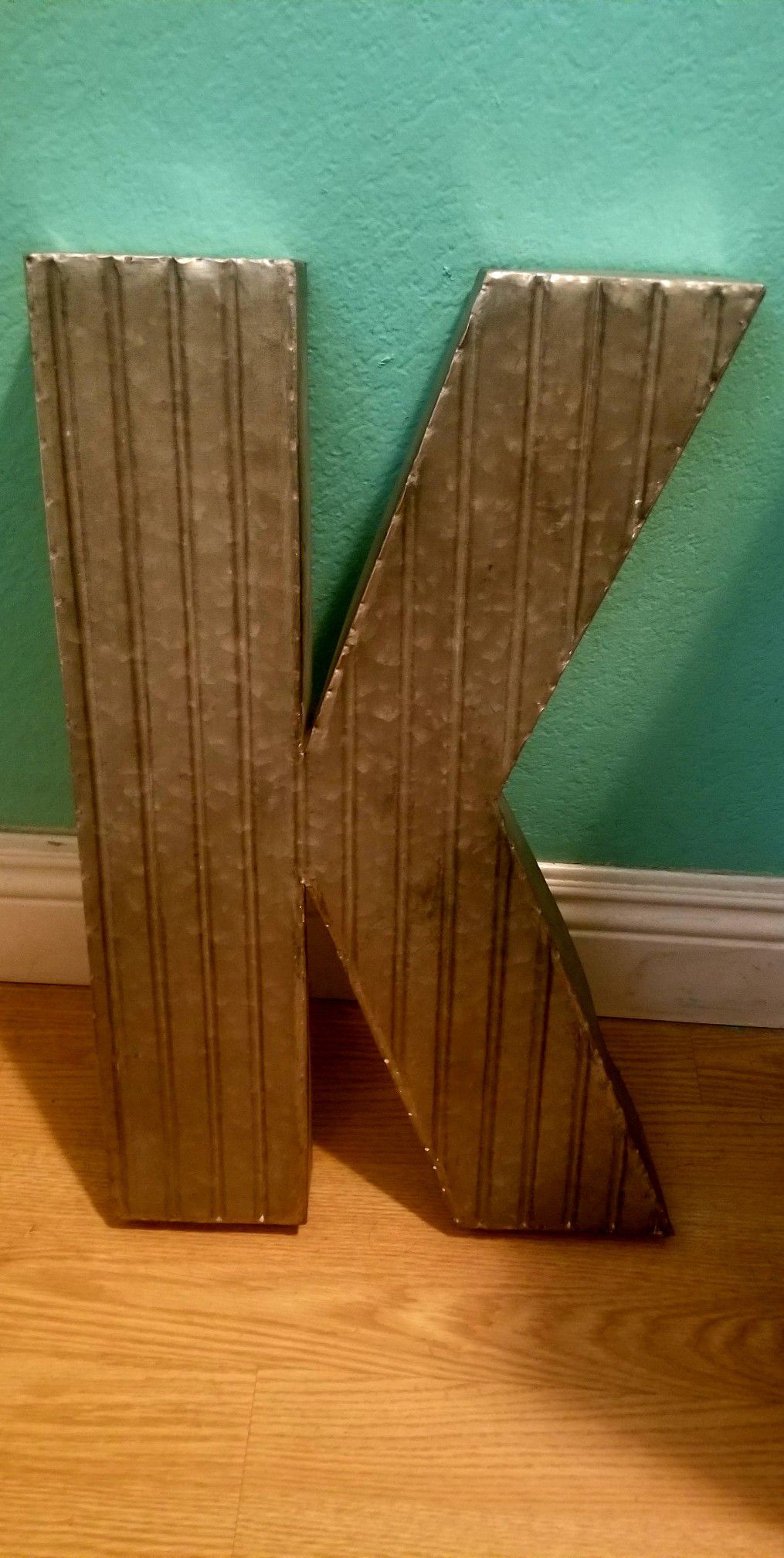 Letter K Sign...Silver metal 20 inches tall by 1 ft wide...Good condition!