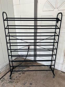Black rack for shoes and wheels