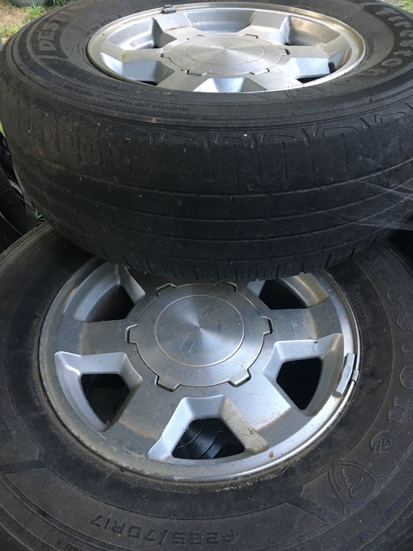 8 factory GM aluminum wheels and tires with caps and lugs. 4 are off 2005 GMC Yukon 17inch. 4 are off a 2002 Chevy Tahoe 16 inch. Tires are not great