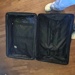 Hurley brand hardside upright suitcase