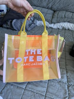 Marc Jacobs The Mesh Tote Bag in yellow and multicolor mesh material.